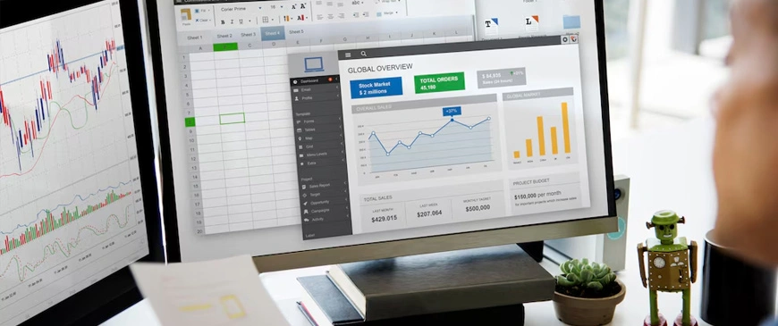 Professional using bookkeeping and accounting software on a dual-monitor setup