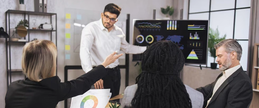 Team meeting discussing business growth strategy as part of professional Business Setup Services