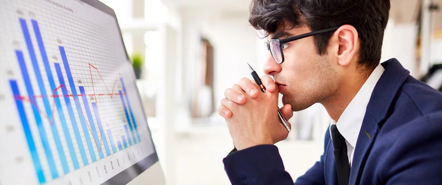 Professional auditor analyzing financial reports at an audit firm in Dubai